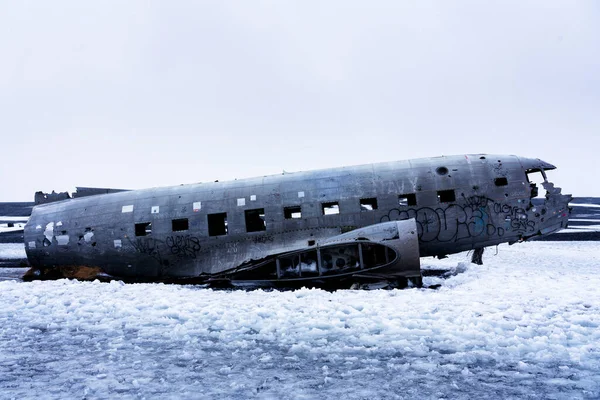 Twisted wreckage from an airplane crash in Iceland on Solheimasandur black sand beach