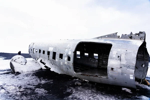 Twisted wreckage from an airplane crash in Iceland on Solheimasandur black sand beach