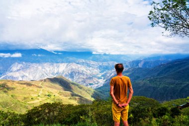 Man admiring views of Chicamocha canyon in Colombia in the Andes mountain range. South America clipart