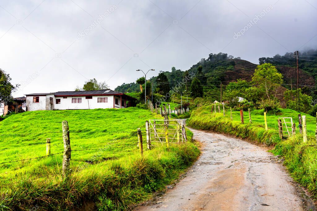 Farmhouse lodge in the rural mountainous part of Colombia located among rolling hills and coffee plantations.