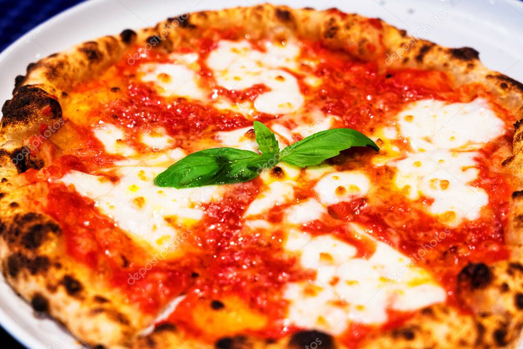 Italian food, pizza Margherita with cheese,basil, tomato sauce