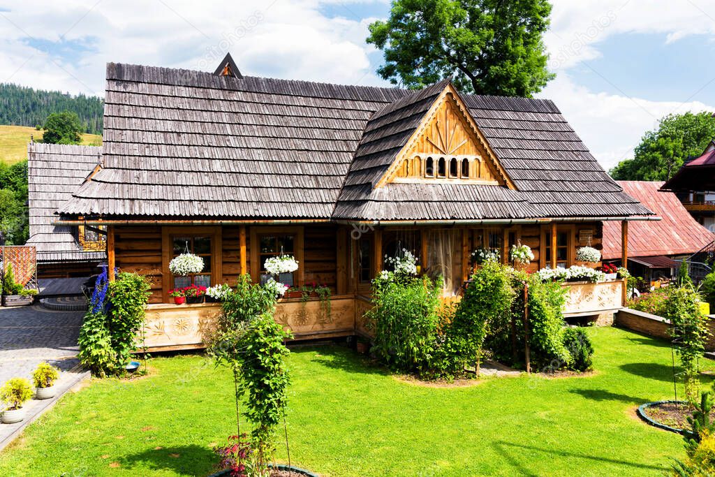 Traditional wooden house in Zakopane, Poland. Zakopane is a popular tourist destination and a gateway to Tatra Mountains.