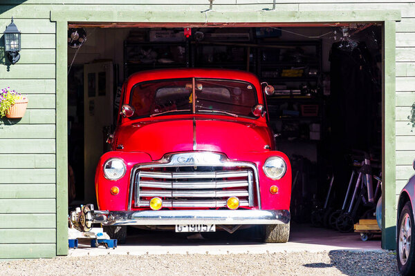 LOFOTEN, NORWAY - SEPT 9, 2019:  Vintage GMC pickup truck parked in a garage, Norway