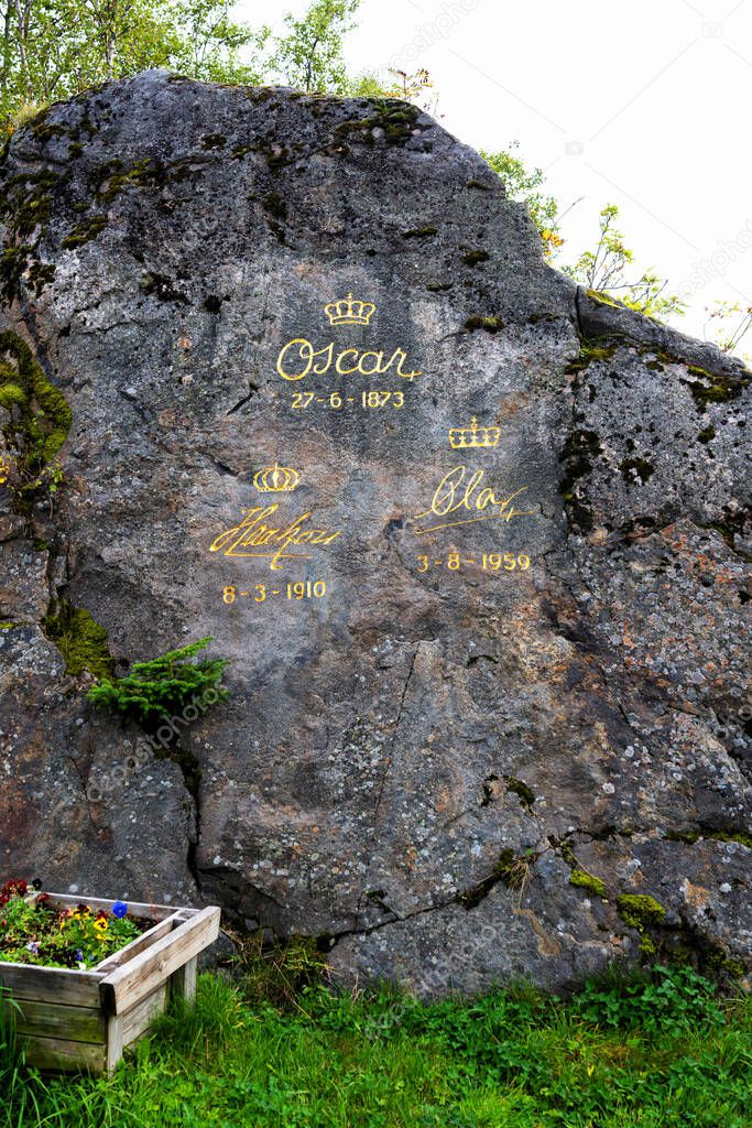 LOFOTEN, NORWAY - SEPT 10, 2019: Signs of three Norwegian kings placed on a solid rock