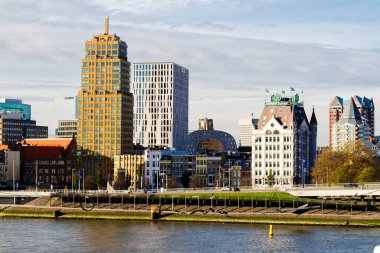 ROTTERDAM, THE NETHERLANDS - NOVEMBER 10, 2015 Rotterdam city skyline, The Netherlands. Rotterdam has one of the world biggest harbour in the world. clipart