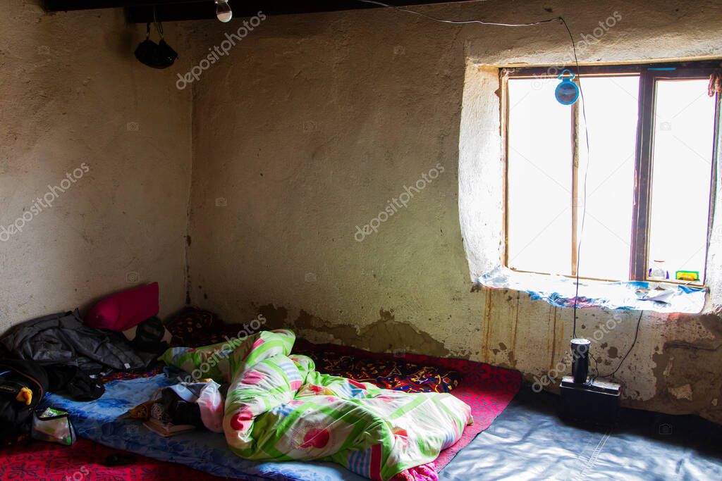 PAMIR, TAJIKISTAN - JULY 24, 2015: Inside shepher's hut in Tajik Pamir mountains, Tajikistan, Central Asia