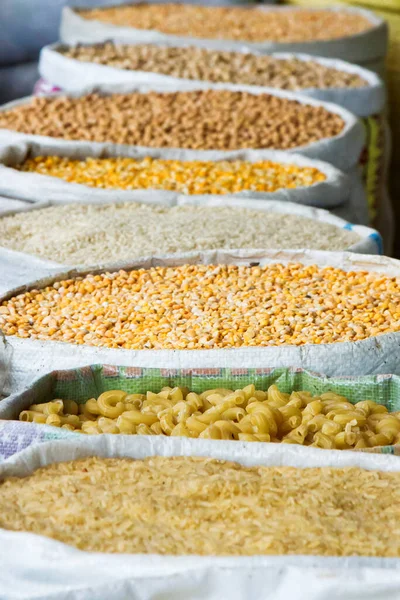 Grains and beans groceries in bulk bags at market, Khojant, Tajikistan, Central Asia