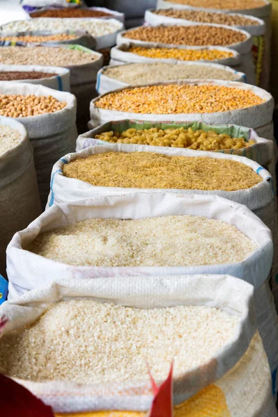 Grains and beans groceries in bulk bags at market, Khojant, Tajikistan, Central Asia