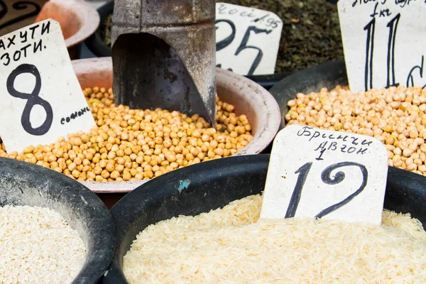 Grains and beans groceries in bulk bags at market, Khojant, Tajikistan, Central Asia