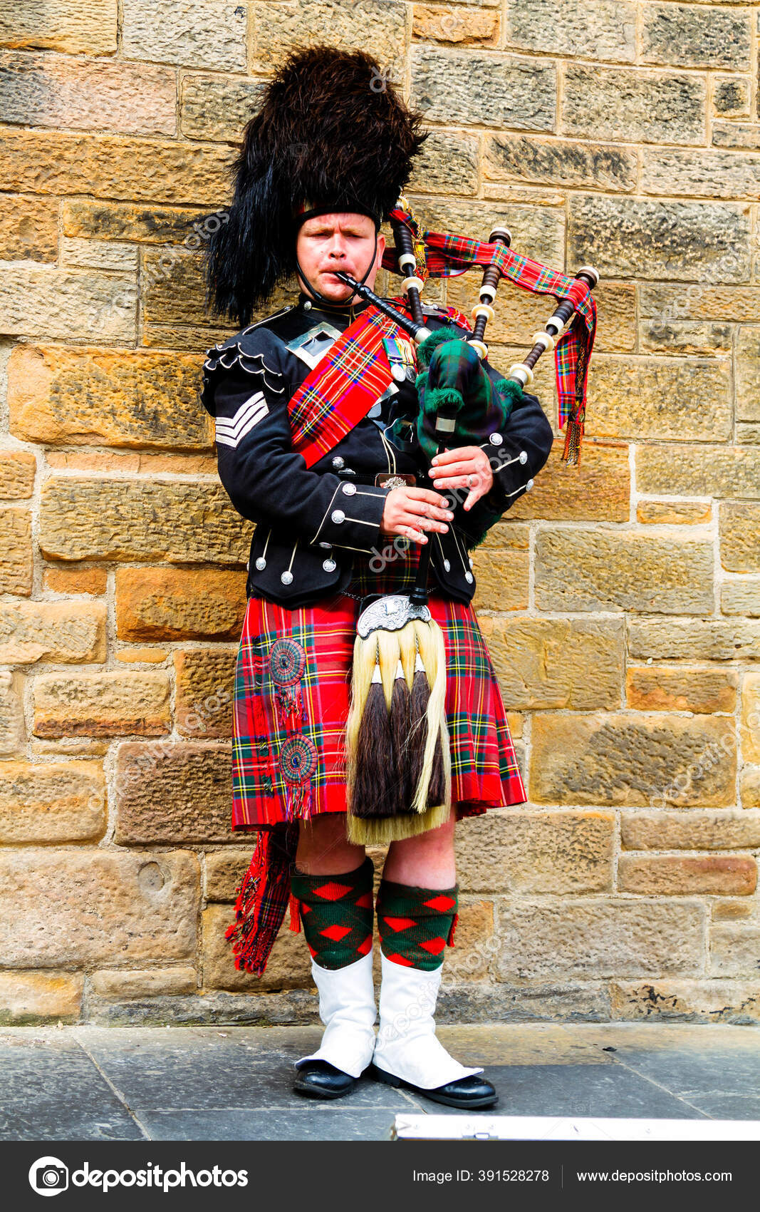 black bagpipe player image black bagpipe player image