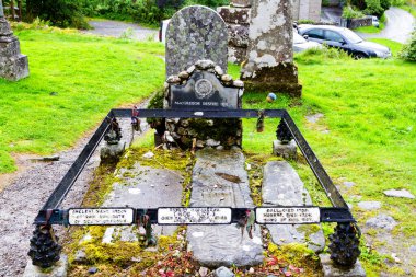 BALQUHIDDER, SCOTLAND - AUGUST 19, 2016: Historic Balquhidder cemetery, the final resting place of the famous Scottish folk hero Rob Roy MacGregor. Scotland, United Kingdom clipart