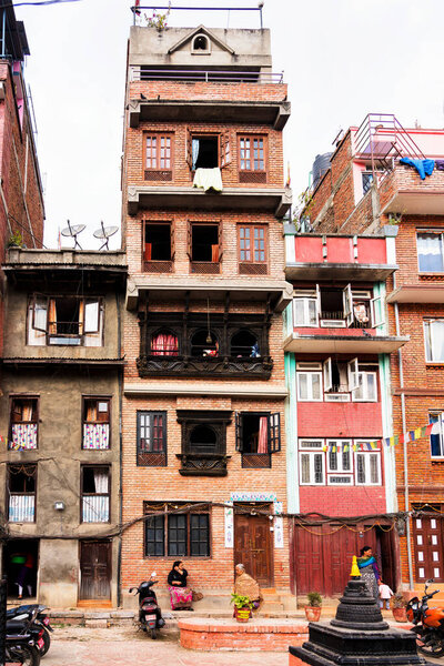 KATHMANDU, NEPAL - DEC 11, 2018: View of a building facades in the capital of Nepal - Kathmandu. Kathmandu and Nepal suffered during 2015 earthquake.