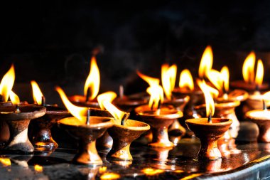 Spiritual prayer candles at temple in Kathmandu, Nepal clipart