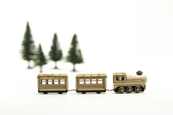 Golden Wooden Toy Train Isolated White Background Blur Pine Tree — Stock Photo, Image
