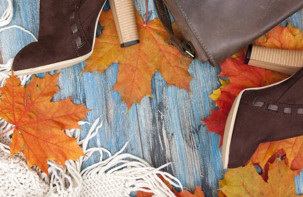 Autumn flat lay female things and accessories on a blue vintage