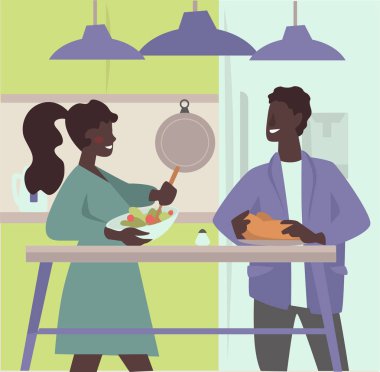 Çift birlikte yemek pişiriyor ve mutfakta yemek hazırlıyor.