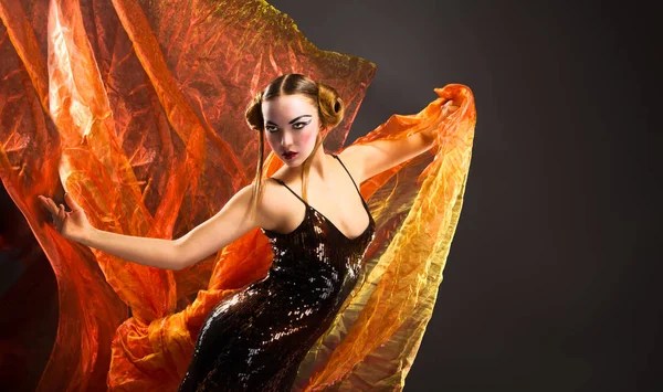 Portrait of a dancing young woman with flying fabric — Stock Photo, Image