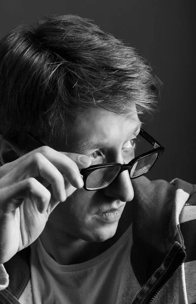 Young mans portrait. Close-up face against gray background — Stock Photo, Image