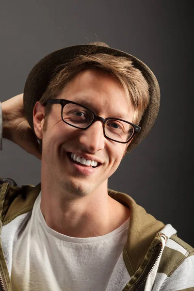 Young mans portrait. Close-up face against gray background — Stock Photo, Image