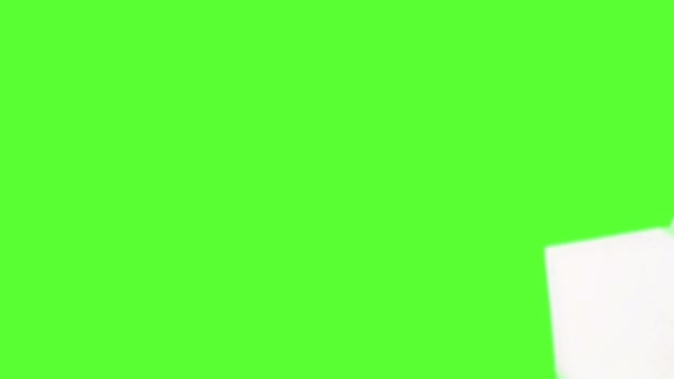 White Note Paper Falling Green Screen Surface — Stock Video