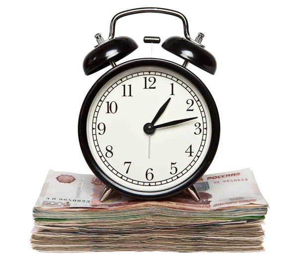 Rus para yığını çalar saat ayakta. Zaman para demektir.