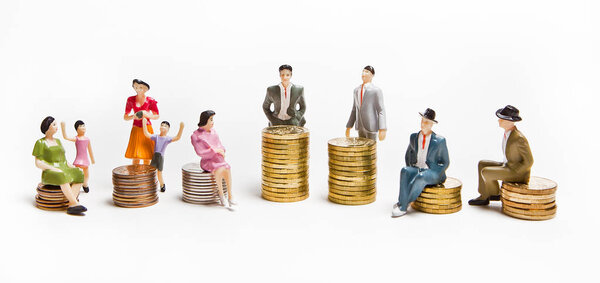 Representatives of different social strata of modern society in the form of dolls with money. The concept of income.