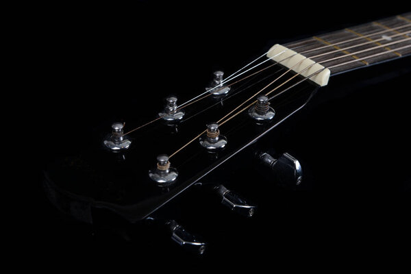 The Chrome tuning Pegs on a Acoustic Guitar