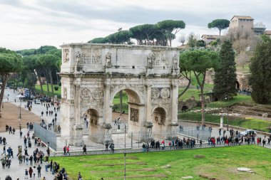 Rome, Italy - December 10, 2017: Aerial view of the historical Arch of Constantine with crowd of tourists wandering around in Rome, Italy clipart