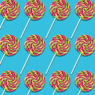 Lolipop şekerler turkuaz arka plan, renkli tatlı gıda doku üzerinde simetrik düzenlenmesi