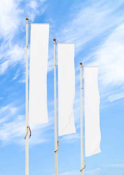 Three Blank White Flags Flagpoles Cloudy Blue Sky Perspective Corporate — Stock Photo, Image