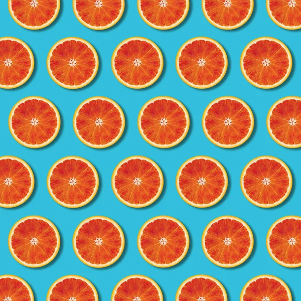 Red Orange Slices Pattern Vibrant Turquoise Color Background Minimal Flat — Stock Photo, Image