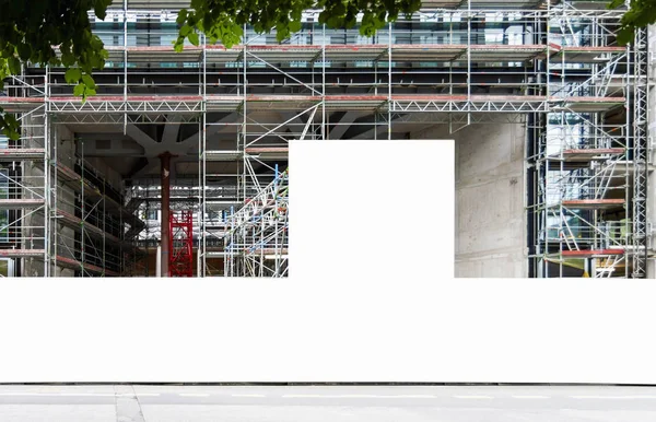 Construction site with blank construction fence mockup — Stock Image Construction site with blank construction fence mockup Royalty Free Stock Photos
