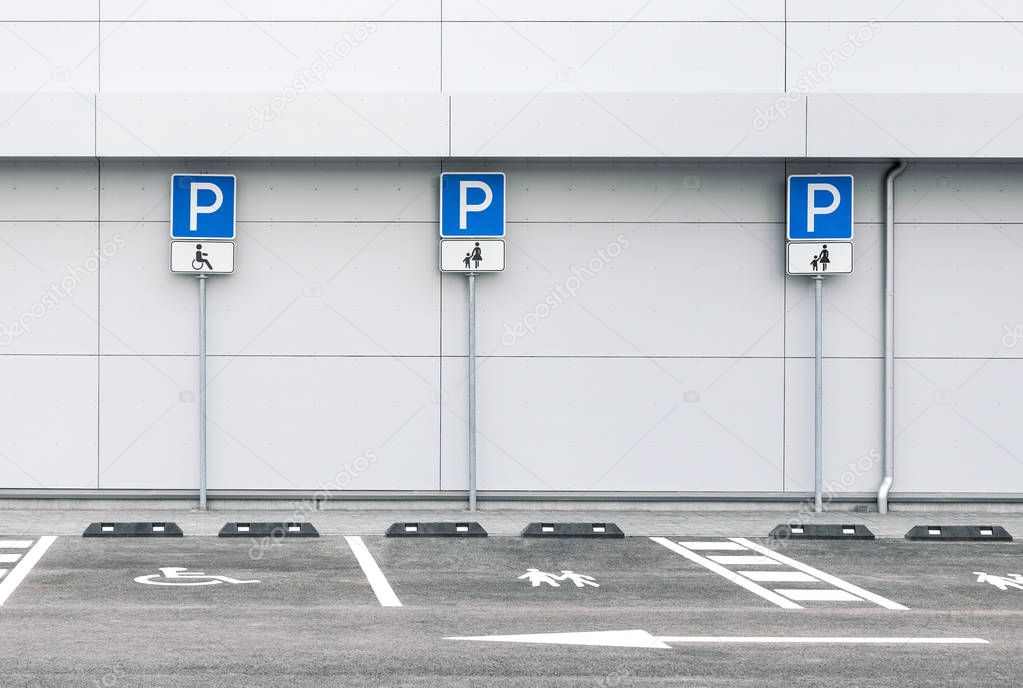 Empty car parking lot with family and disability parking places