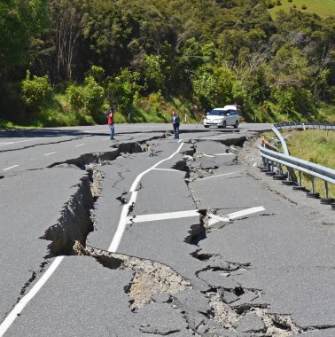 Kaikoura, New Zealand - November 15, 2016: Intrepid TV Reporter & Cameraman risk all to report live from the top of the Hunderlee Hills on Highway One, North Canterbury after the 7.5  Kaikoura Earthquake. clipart