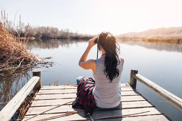 Young Brunette Woman Sitting Lake Jetty Binoculars Plaid Shirt — Stock Photo, Image