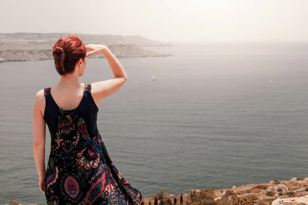 Back View Young Redhead Woman Topknot Standing Cliff Looking Far — Stock Photo, Image