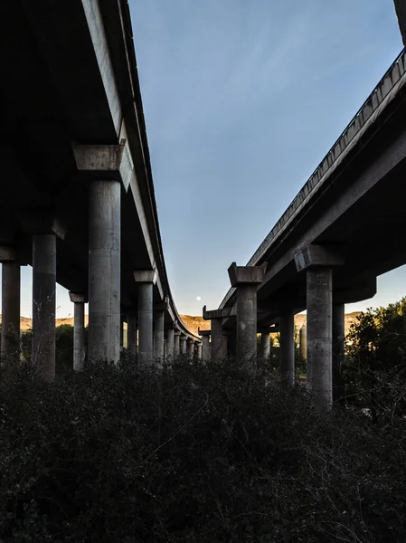 Full moon at the end of a concrete bridge in the afternoon — Stock Photo, Image