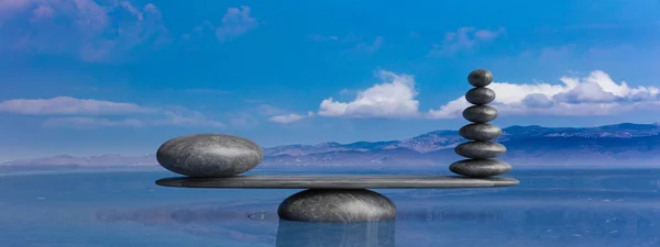 Zen-Steine reihen sich im Wasser mit blauem Himmel von groß nach klein. 3D-Illustration — Stockfoto
