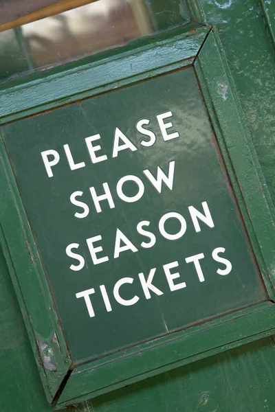 Green Season Ticket Sign on Railway Platform