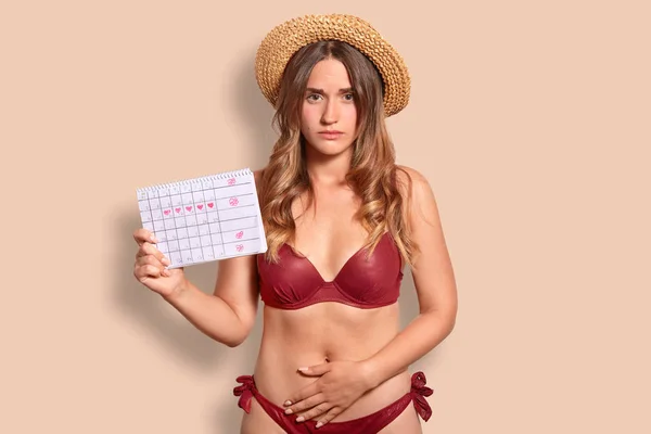 Displeased European Woman Feels Pain Menstruation Keeps Hand Bottom Belly — Stock Photo, Image