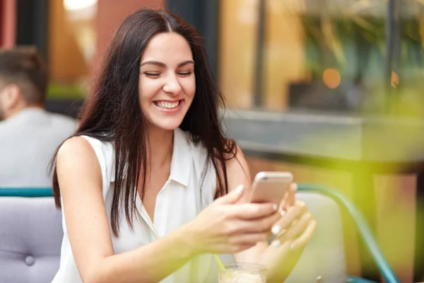 Positive Glad Female Cheerful Expression Holds Smart Phone Glad Recieve — Stock Photo, Image