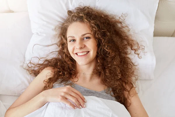 Top View Beautiful Smiling Curly Female Feels Relaxed Happy Morning — Stock Photo, Image