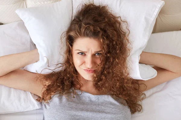 Depressed Frustrated Female Covers Ears Pillow While Lies Bed Can — Stock Photo, Image