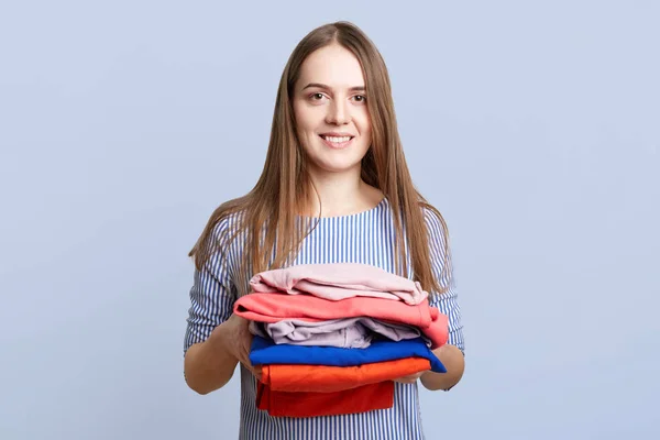 Positive Young Brunette Female Holds Pile Laundry Being Tired Ironing — Stock Photo, Image