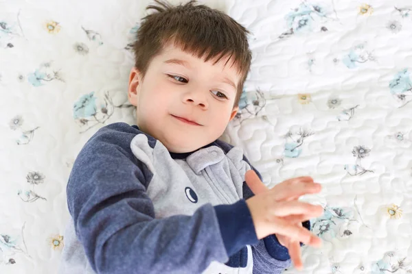 Little Brunet Adorable Boy Appealing Appearance Wears Pyjamas Lies Comfortable — Stock Photo, Image