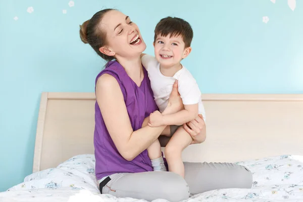 Overjoyed Young Mother Son Smile Joyfully Have Fun Together Sit — Stock Photo, Image