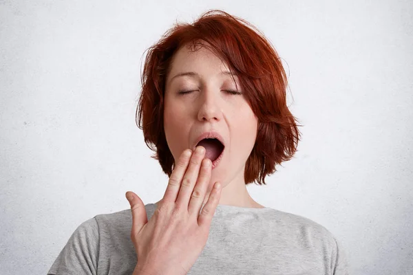 Portrait Freckled Female Red Short Hair Yawns Has Sleepy Expression — Stock Photo, Image