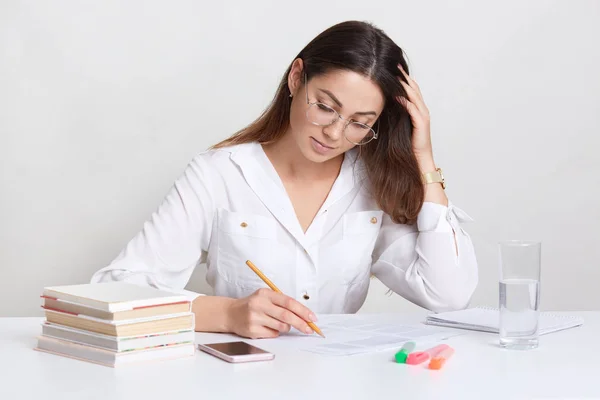 Busy Dark Haired Woman Makes Notes Underlines Information Papers Wears — Stock Photo, Image