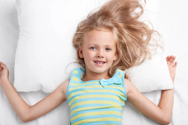 Photo Small Cute Female Child Has Attractive Look Lies Comfortable — Stock Photo, Image