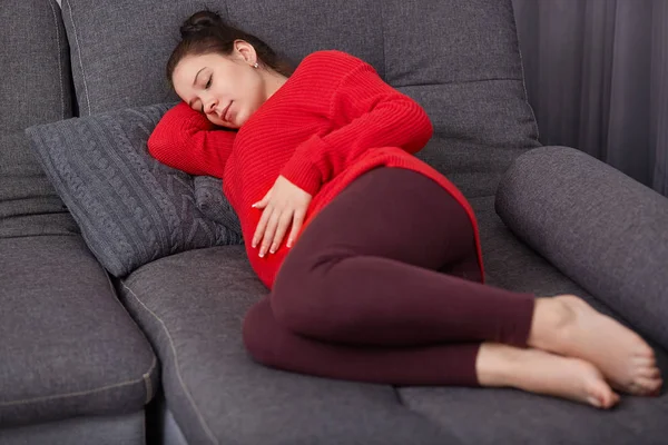 Shot Restful Pregnant Woman Keeps Hand Tummy Wears Casual Clothes — Stock Photo, Image